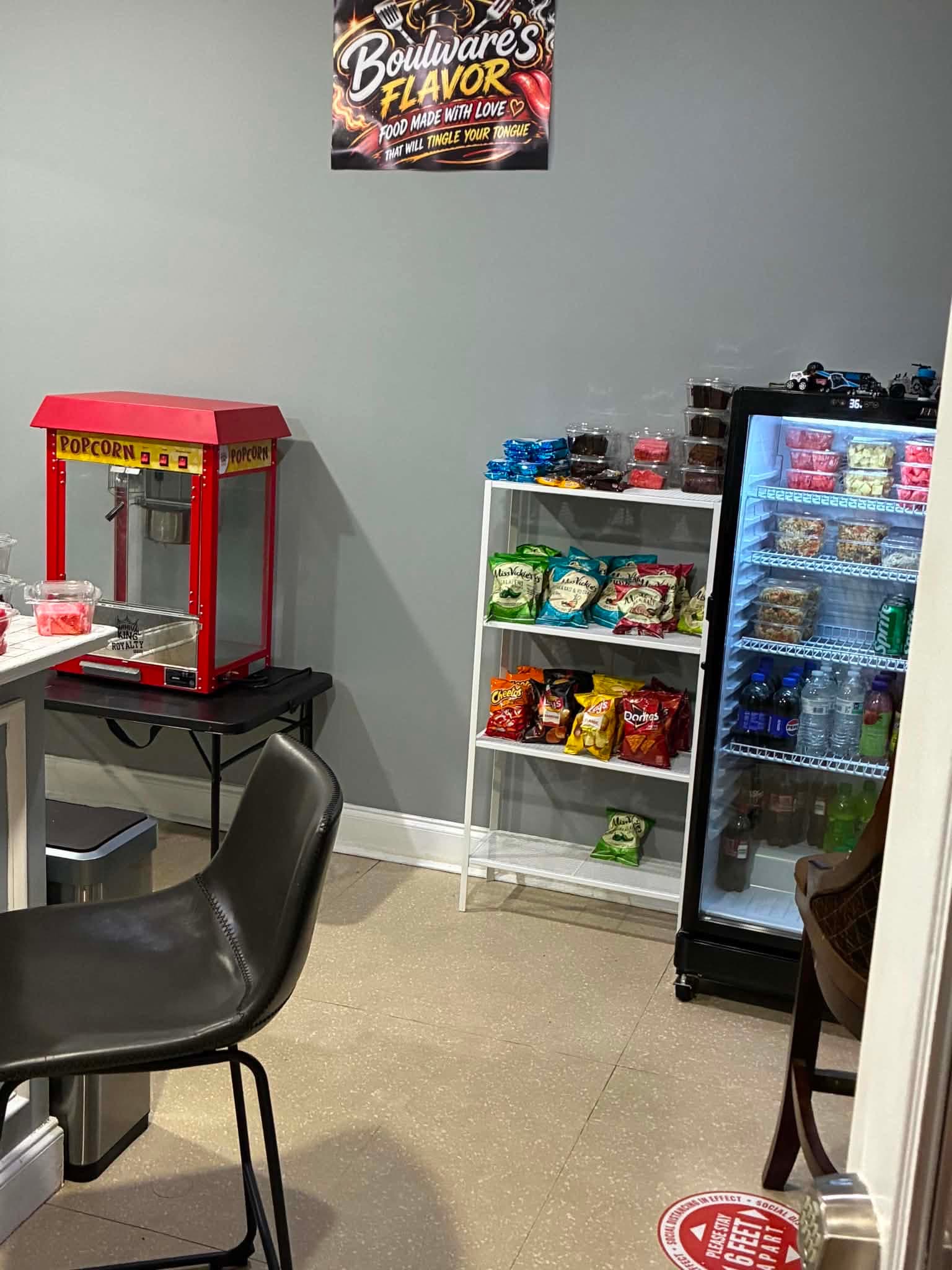 Inside Boulware's Flavor Café: the popcorn machine, snack shelf and drinks cooler